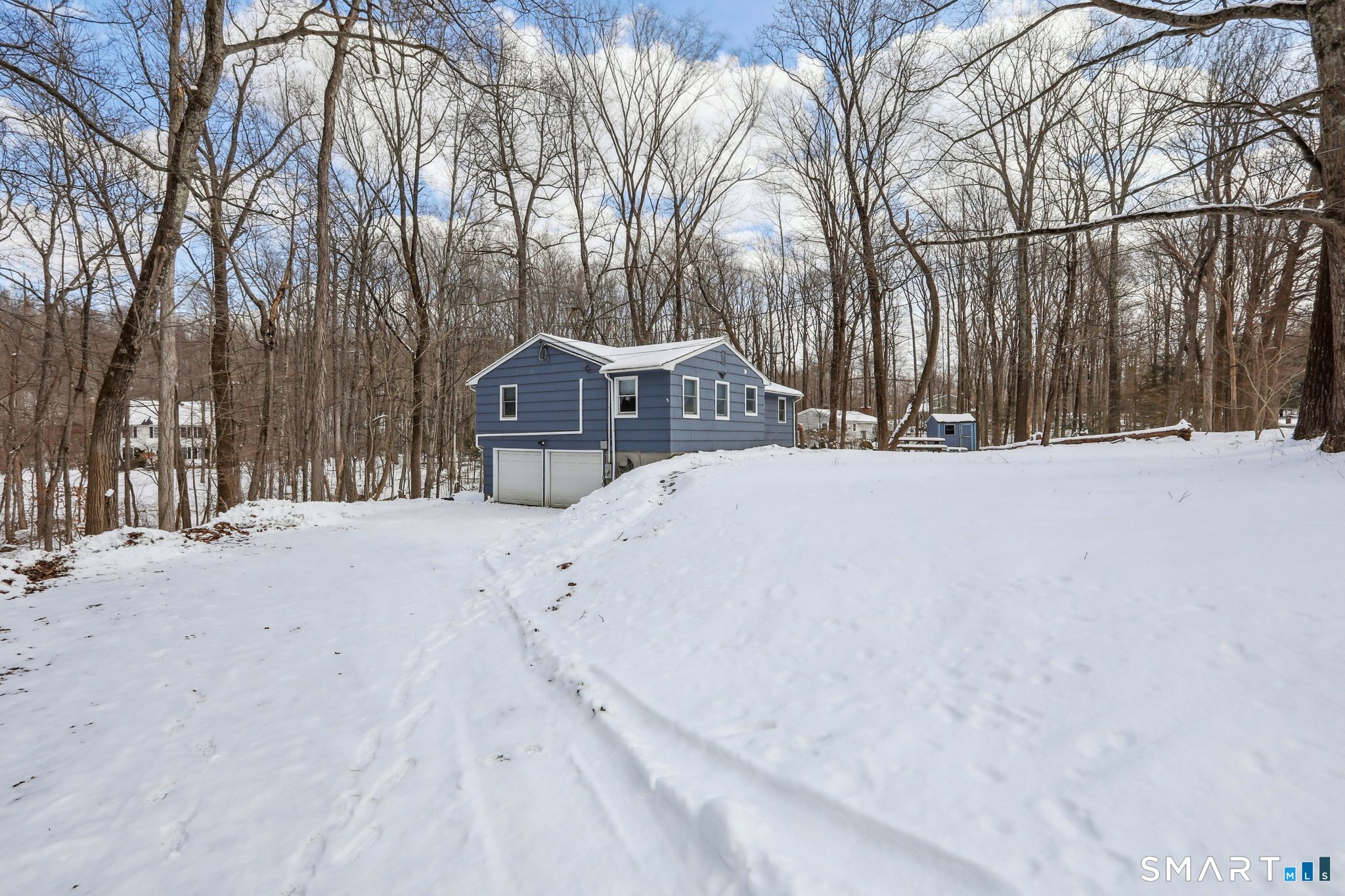643 Bucks Hill Road Southbury, CT 06488 - Photo 22 of 25 a view of a house with a snow in the yard