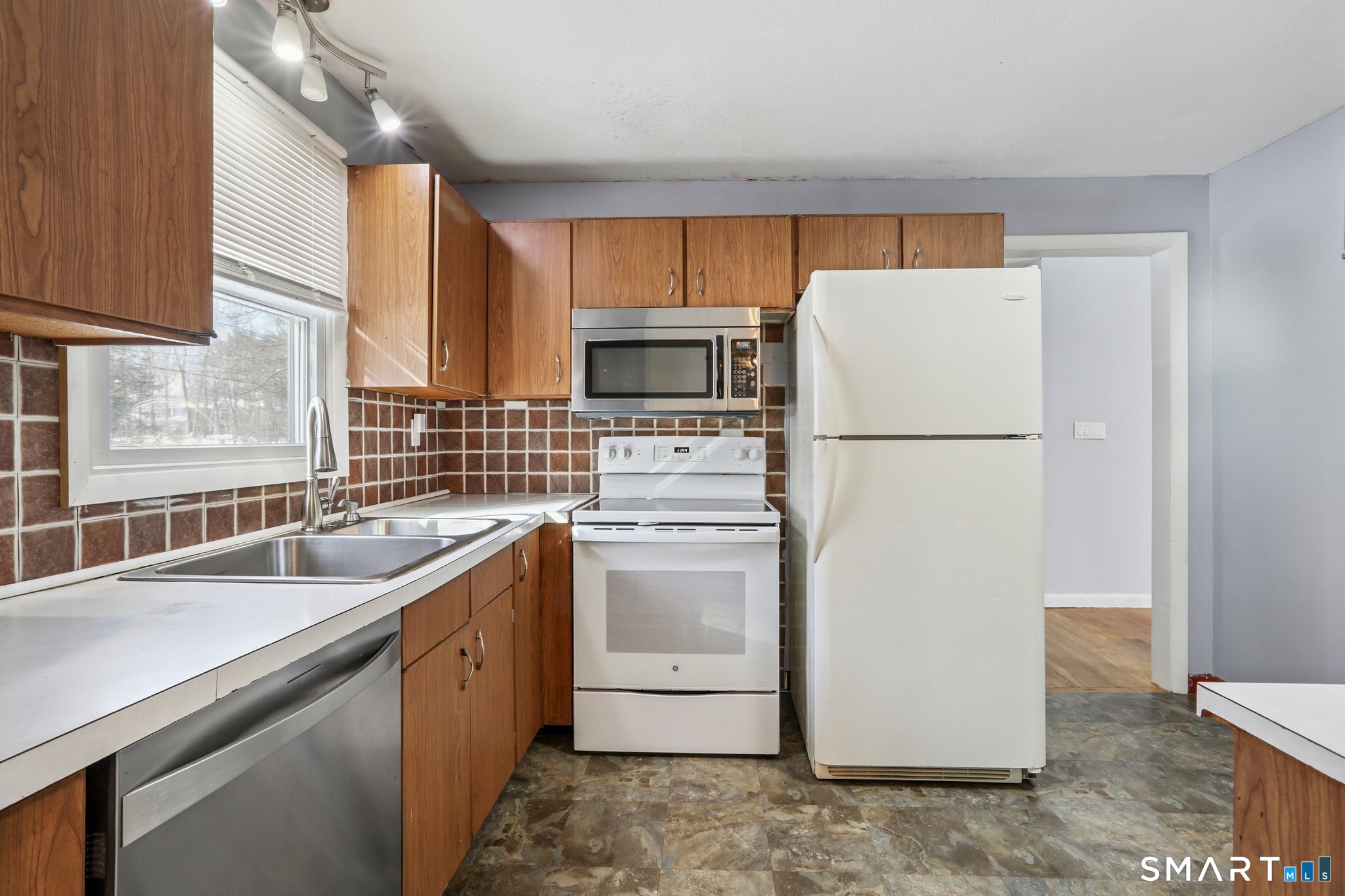 643 Bucks Hill Road Southbury, CT 06488 - Photo 8 of 25 a kitchen with a refrigerator sink and stove