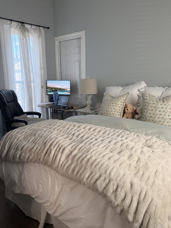 562 East 7th Street, Unit 2 Boston, MA 02127 - Photo 5 of 18 a bedroom with a bed and a window