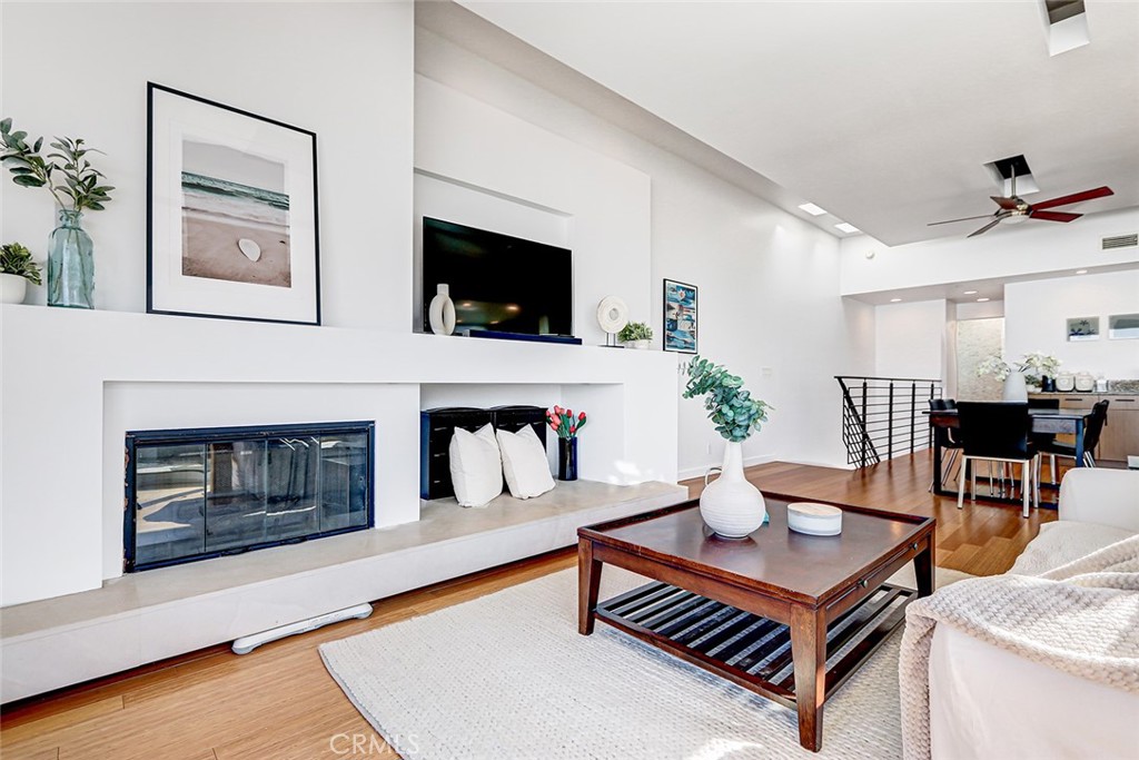 4321 Crest Drive Manhattan Beach, CA 90266 - Photo 18 of 37 a living room with furniture a fireplace and a flat screen tv