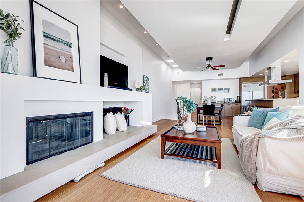 4321 Crest Drive Manhattan Beach, CA 90266 - Photo 20 of 37 a living room with furniture a fireplace and a flat screen tv