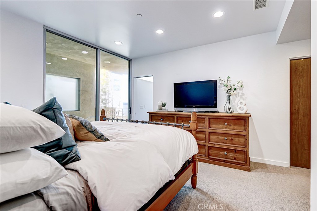 4321 Crest Drive Manhattan Beach, CA 90266 - Photo 26 of 37 a bedroom with a bed and a flat screen tv