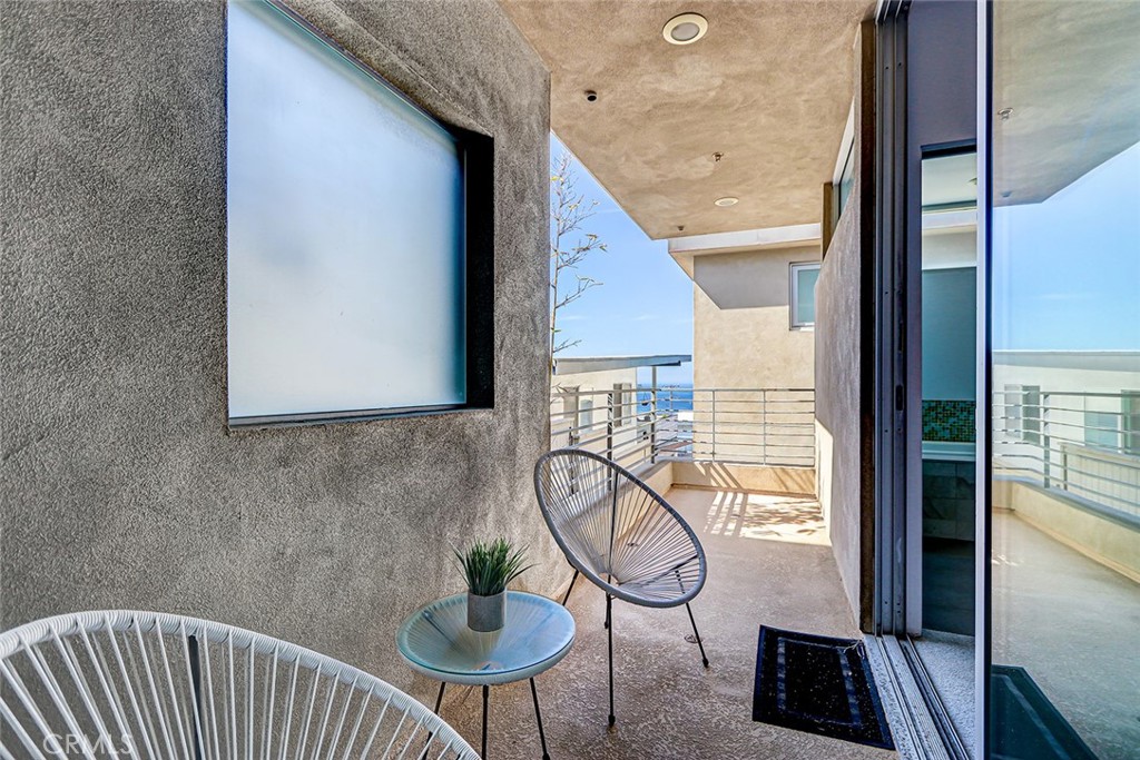 4321 Crest Drive Manhattan Beach, CA 90266 - Photo 28 of 37 a view of a hallway to a livingroom with furniture and wooden floor