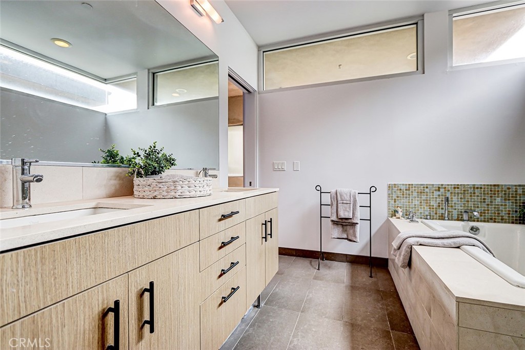 4321 Crest Drive Manhattan Beach, CA 90266 - Photo 31 of 37 a bathroom with a sink and a mirror
