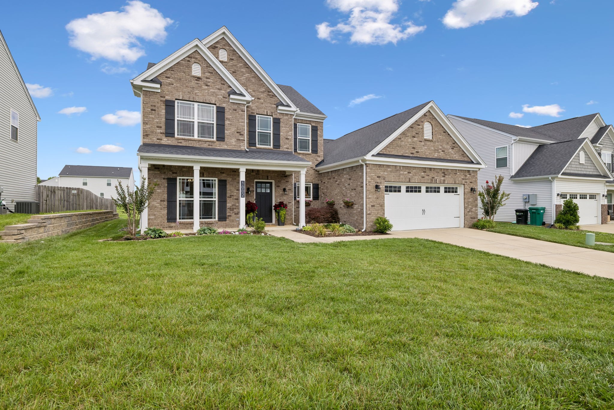 1002 Garrison Way Spring Hill, TN 37174 - Photo 2 of 63 a front view of a house with a yard