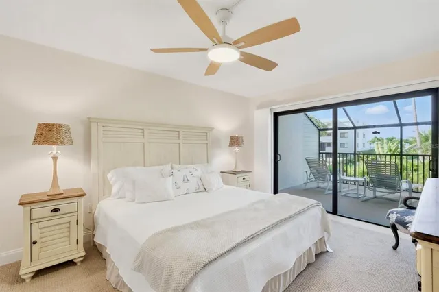 a bedroom with a bed and a night stand