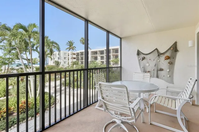 a view of a chairs and table in patio