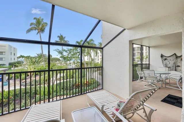 a view of a balcony with furniture