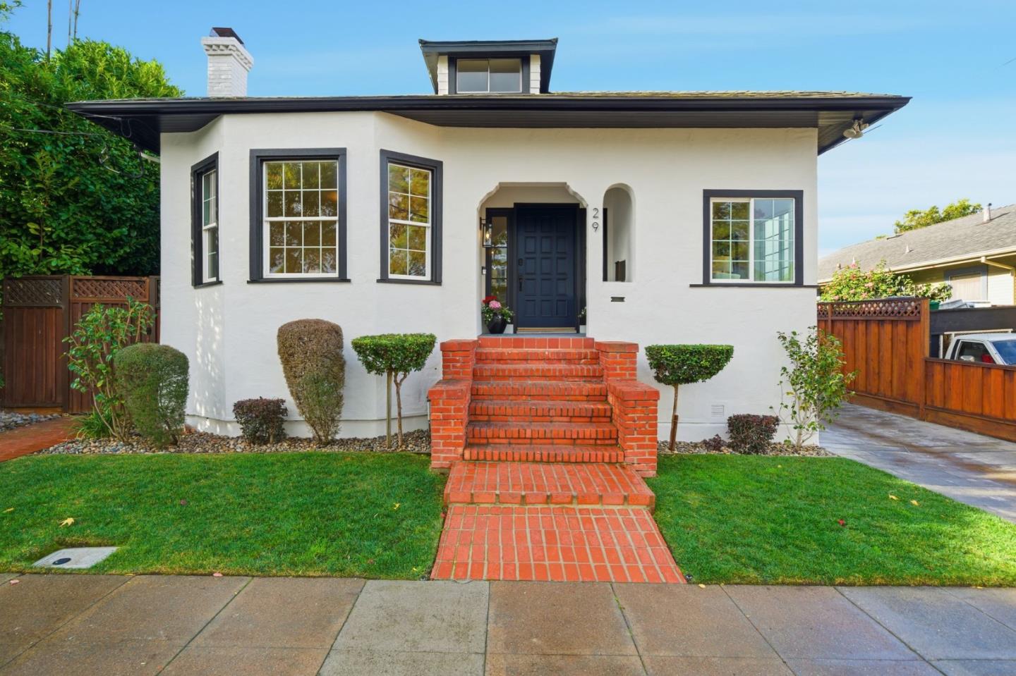 a front view of a house with garden