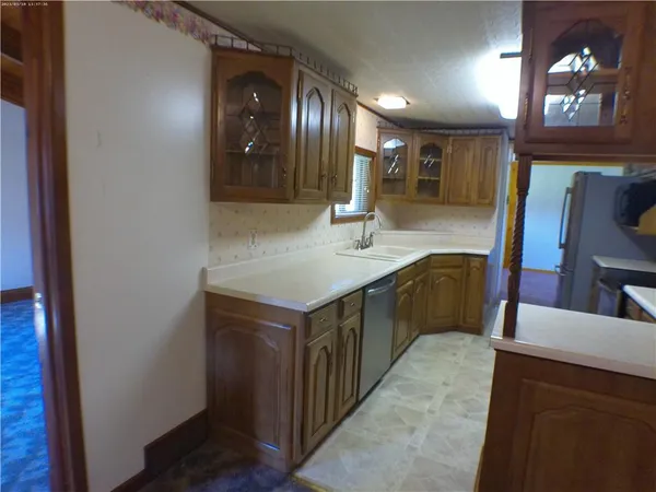 a kitchen with a sink and a refrigerator