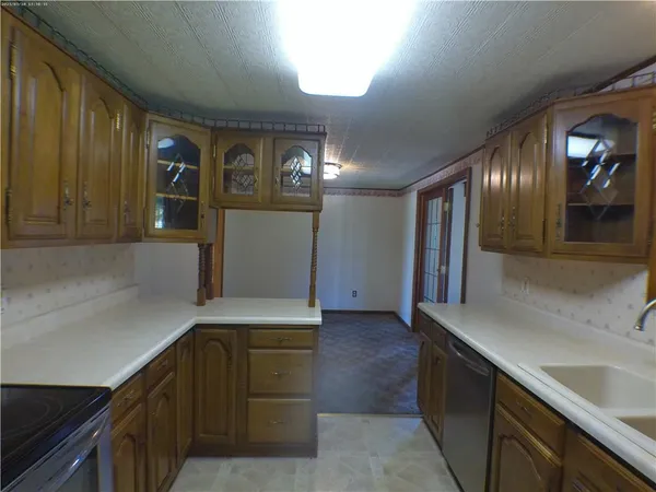 a view of a kitchen with car parked