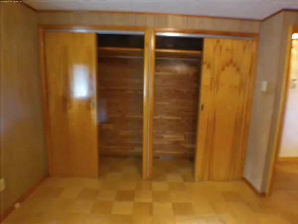 an empty room with a wooden door