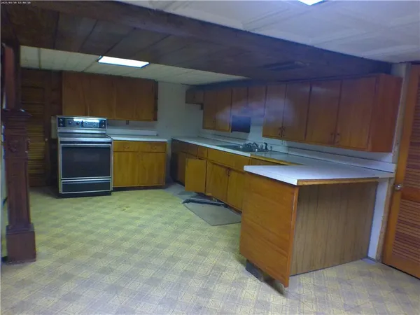 a kitchen with stainless steel appliances a stove and a refrigerator