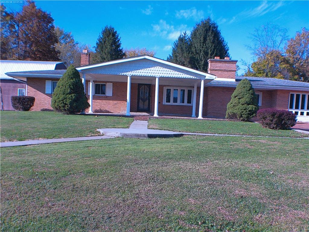 105 Single Street Carmichaels, PA 15320 - Photo 7 of 43 a front view of a house with a yard