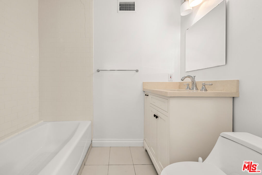 1849 Benecia Avenue Los Angeles, CA 90025 - Photo 23 of 59 a bathroom with a sink toilet and shower