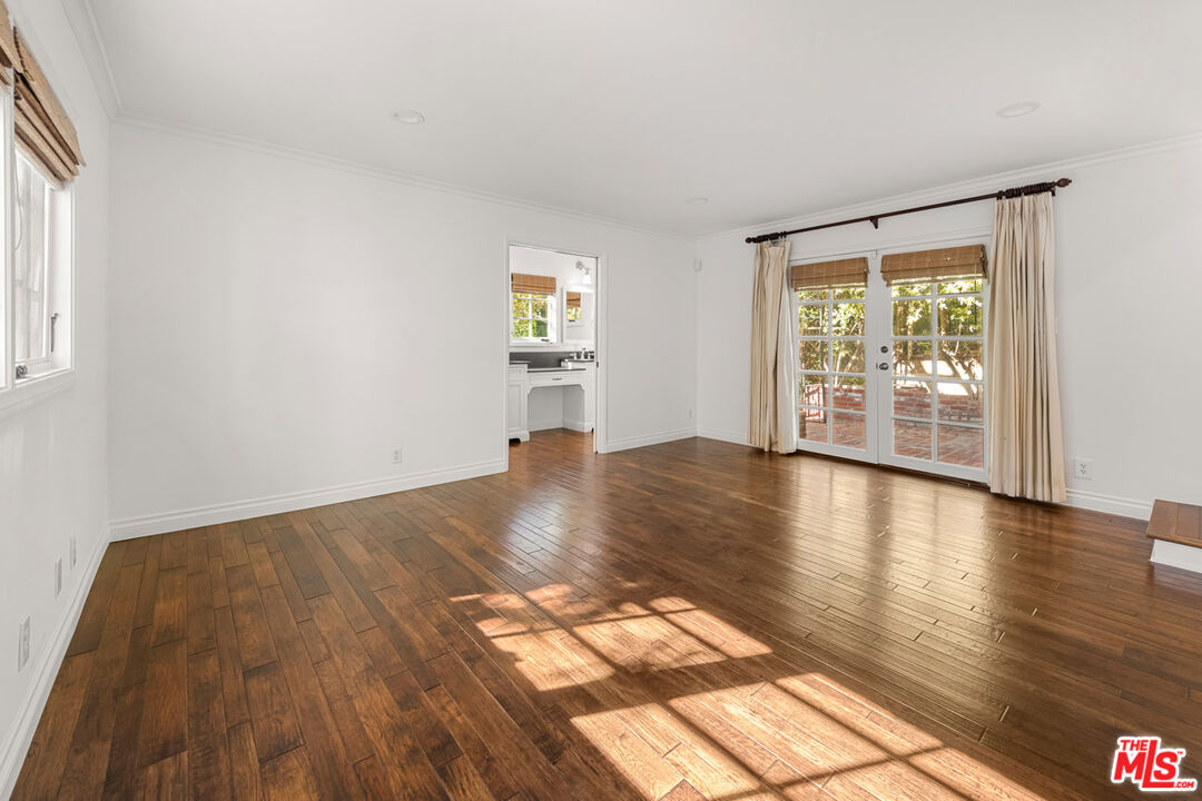 1849 Benecia Avenue Los Angeles, CA 90025 - Photo 25 of 59 a view of empty room with wooden floor and fan