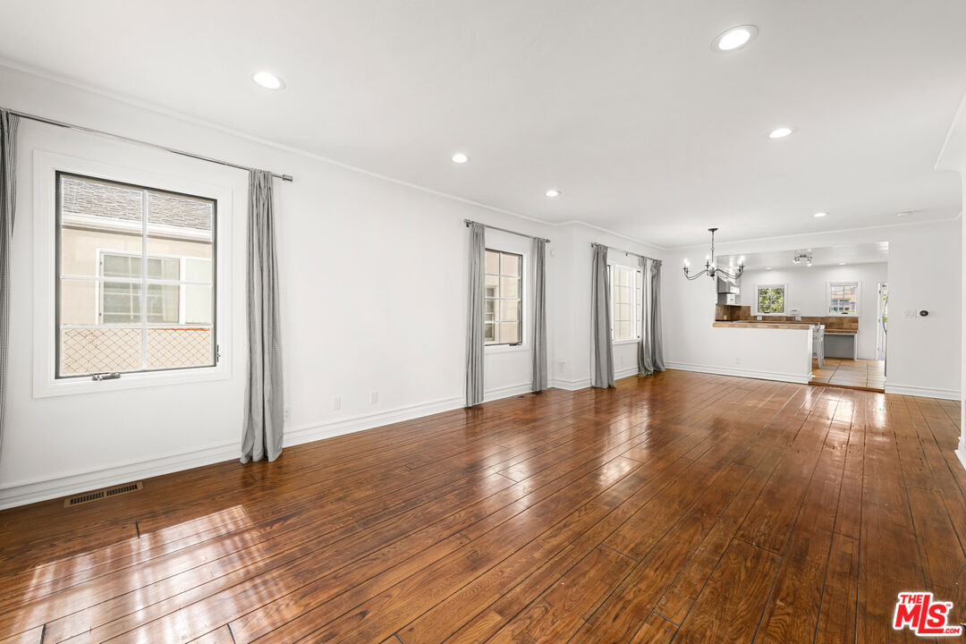 1849 Benecia Avenue Los Angeles, CA 90025 - Photo 3 of 59 a view of empty room with wooden floor