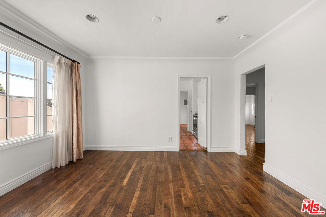 1849 Benecia Avenue Los Angeles, CA 90025 - Photo 33 of 59 an empty room with wooden floor and windows