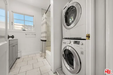 a kitchen with stainless steel appliances a refrigerator sink and cabinets