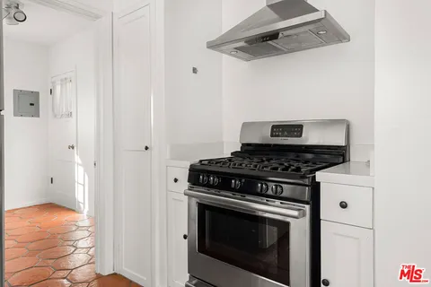 a view of a kitchen with electric appliances