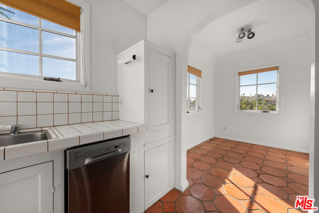 1849 Benecia Avenue Los Angeles, CA 90025 - Photo 41 of 59 a bedroom with a bed and a window