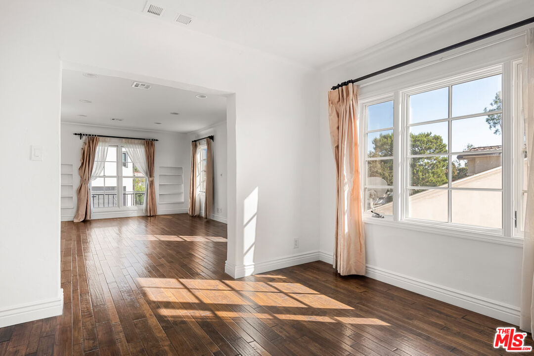 1849 Benecia Avenue Los Angeles, CA 90025 - Photo 46 of 59 wooden floor in an empty room with a window