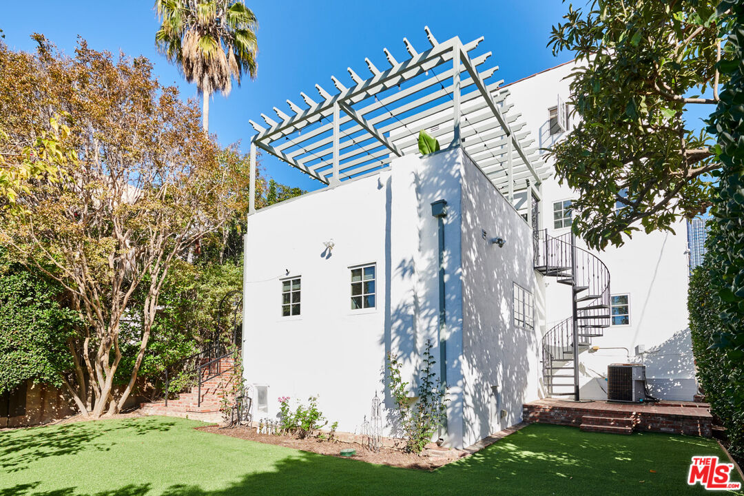 1849 Benecia Avenue Los Angeles, CA 90025 - Photo 54 of 59 a backyard of a house with lots of green space