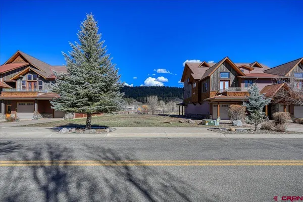 a view of a house with a street