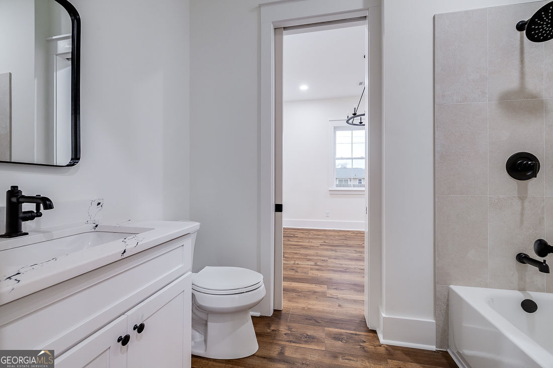 610 Rogers Street Pooler, GA 31322 - Photo 22 of 30 a bathroom with a sink a toilet and shower