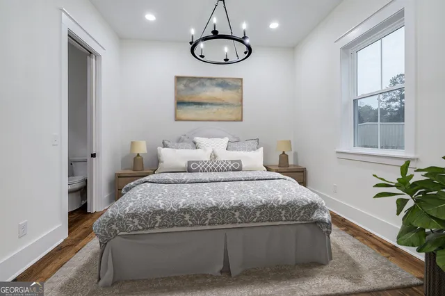 a bedroom with a bed and window