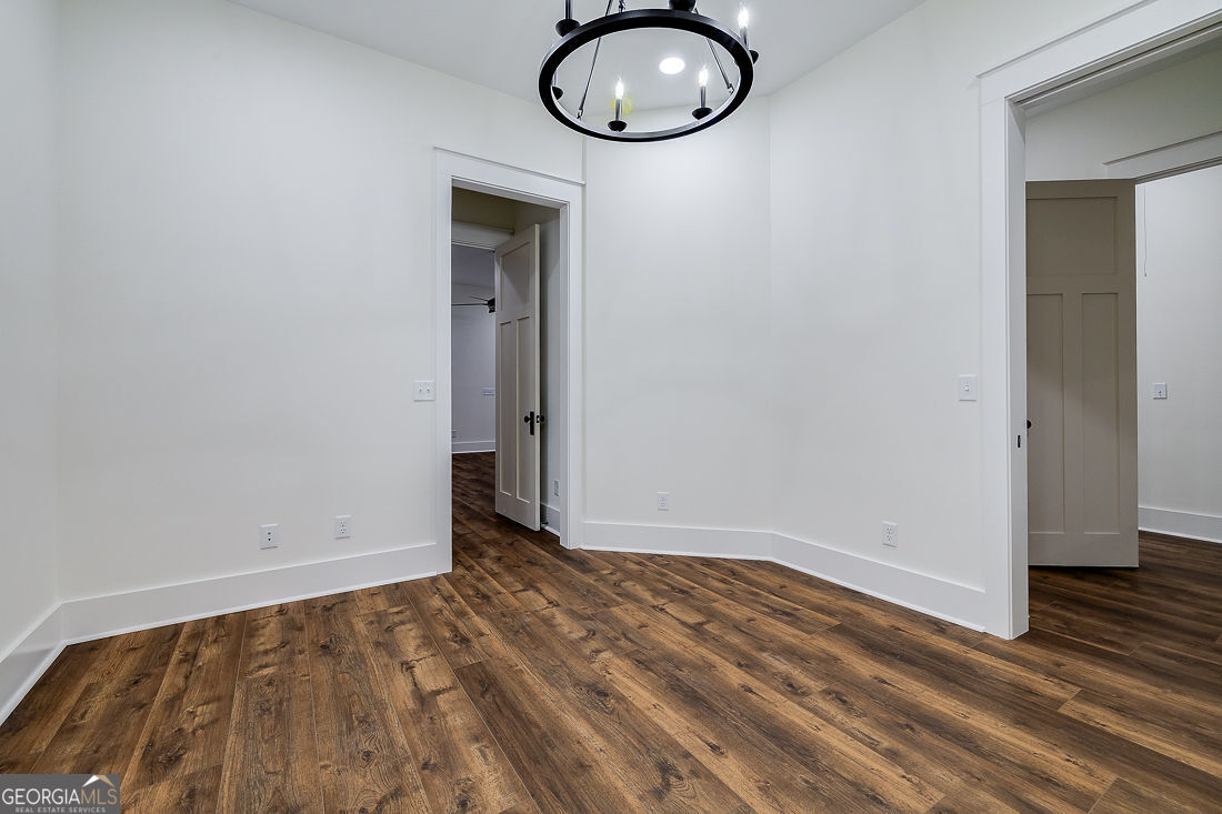 610 Rogers Street Pooler, GA 31322 - Photo 24 of 30 an empty room with wooden floor and windows