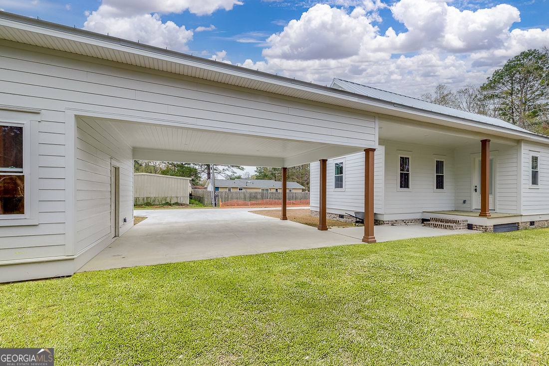610 Rogers Street Pooler, GA 31322 - Photo 30 of 30 a swimming pool with outdoor seating and yard