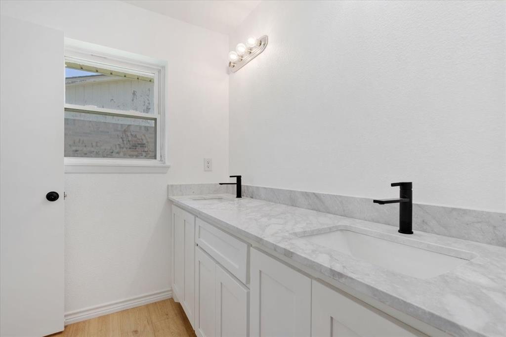 Undisclosed Address Howe, TX 75459 - Photo 13 of 29 a bathroom with a sink and vanity
