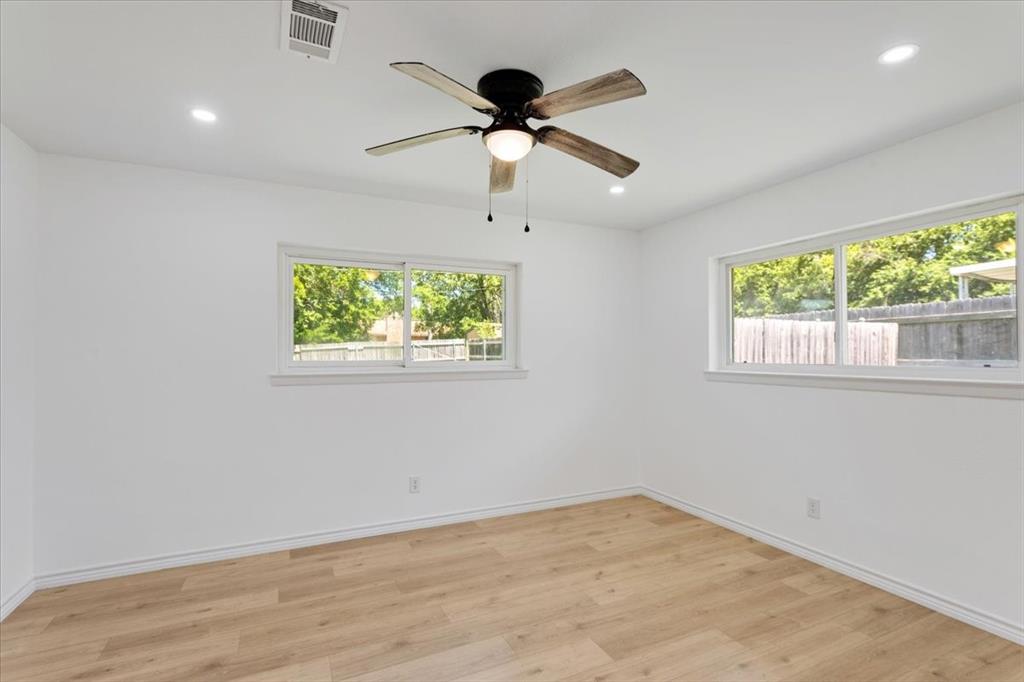 Undisclosed Address Howe, TX 75459 - Photo 15 of 29 a view of empty room with wooden floor and fan