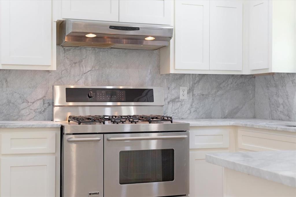 Undisclosed Address Howe, TX 75459 - Photo 18 of 29 a stove top oven sitting inside of a kitchen