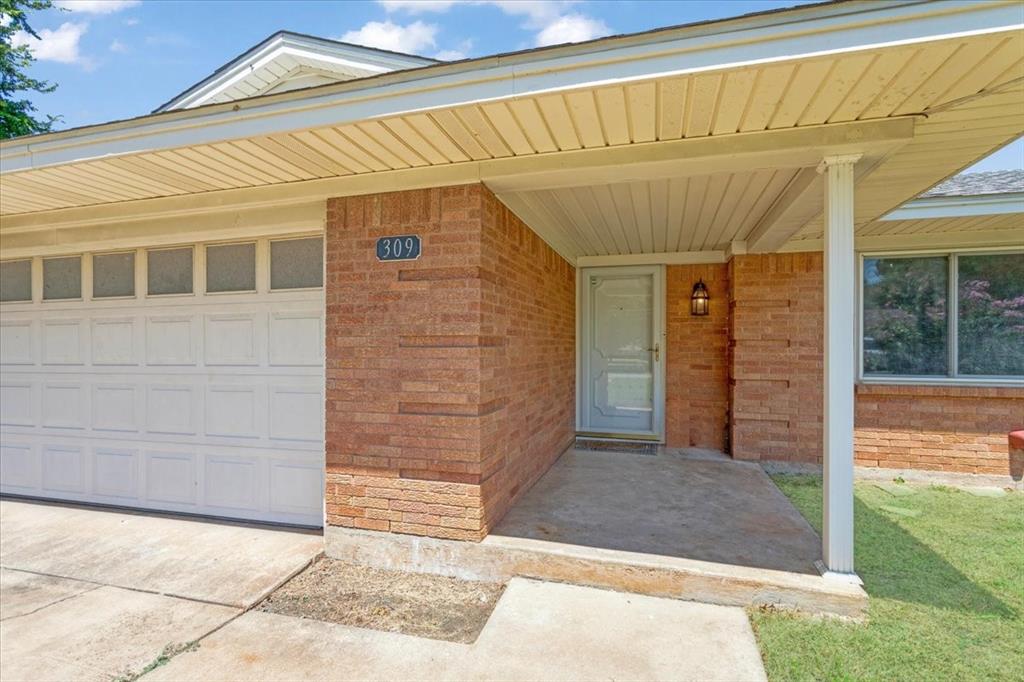 Undisclosed Address Howe, TX 75459 - Photo 2 of 29 a front view of a house with a garden