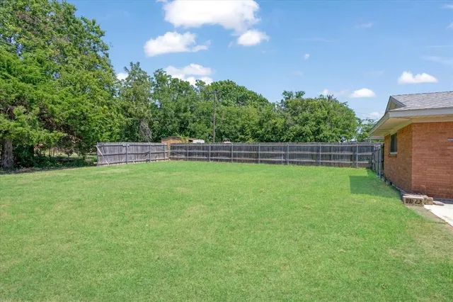 a view of outdoor space with deck and yard