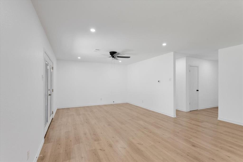 Undisclosed Address Howe, TX 75459 - Photo 5 of 29 wooden floor in an empty room with a window