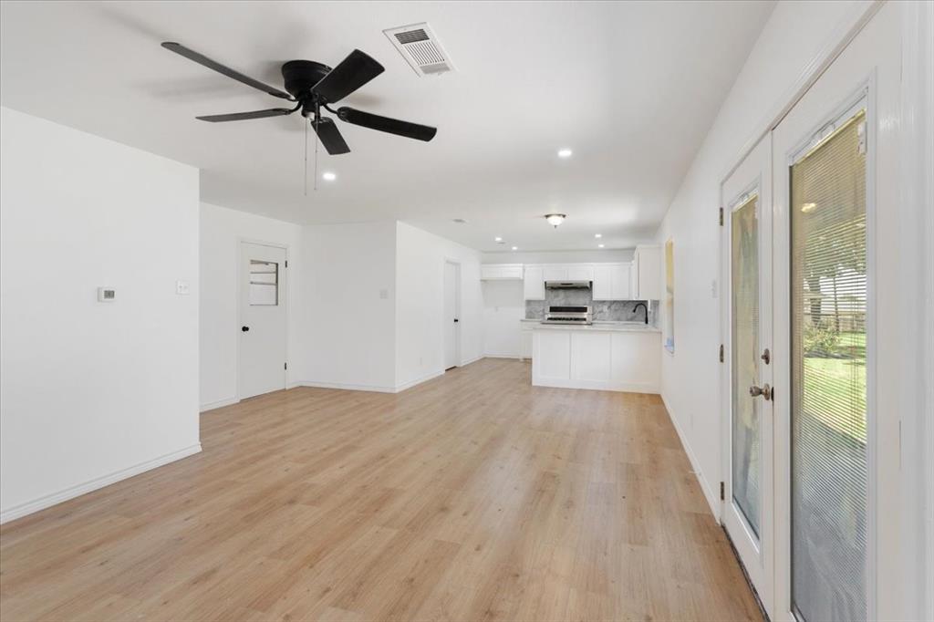 Undisclosed Address Howe, TX 75459 - Photo 6 of 29 a view of a kitchen with a sink and wooden floor