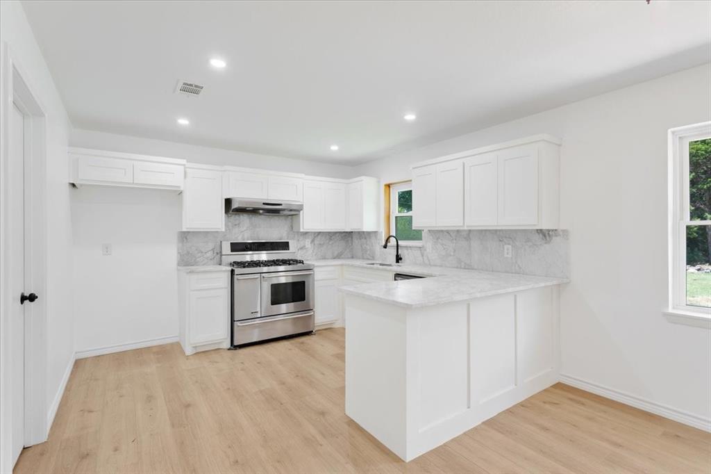 Undisclosed Address Howe, TX 75459 - Photo 8 of 29 a kitchen with granite countertop a sink and steel appliances