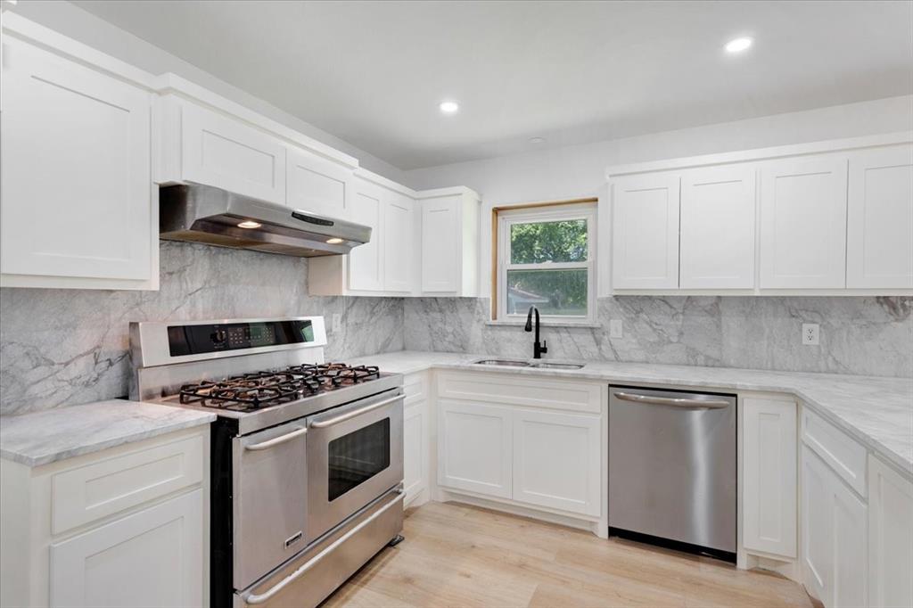 Undisclosed Address Howe, TX 75459 - Photo 9 of 29 a kitchen with white cabinets and appliances