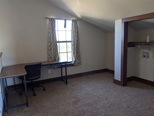 a room with furniture and a window