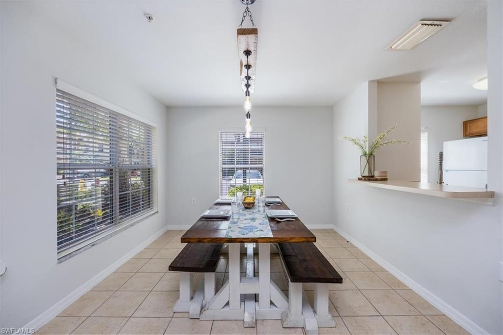9072 Gervais Circle, Unit 307 Naples, FL 34120 - Photo 4 of 32 a room with furniture and window