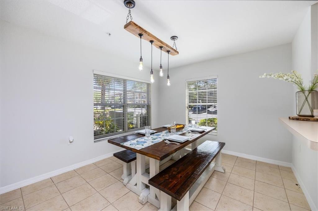9072 Gervais Circle, Unit 307 Naples, FL 34120 - Photo 5 of 32 a living room with furniture and a window