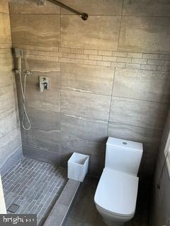 6907 Jones View Drive, Unit 3C Baltimore, MD 21209 - Photo 4 of 14 a bathroom with a toilet and a shower