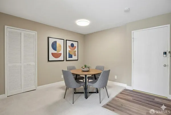 a dining room with furniture and window