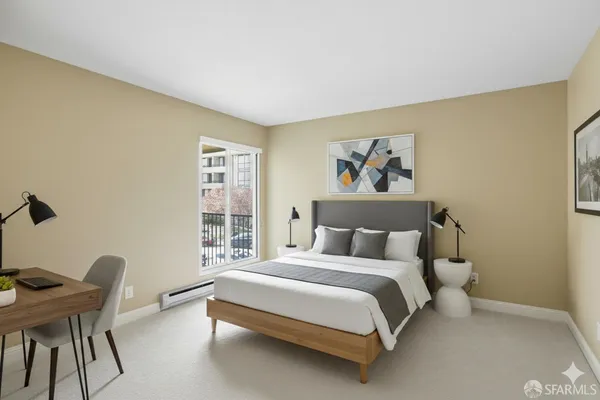 a bedroom with a bed and a chair