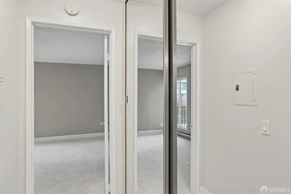 a bathroom with a glass shower door