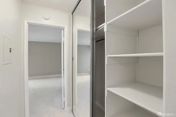 a bathroom with a glass shower door