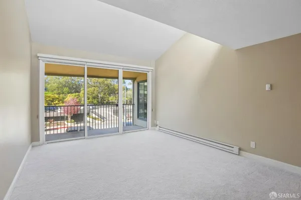 a view of an empty room with a balcony
